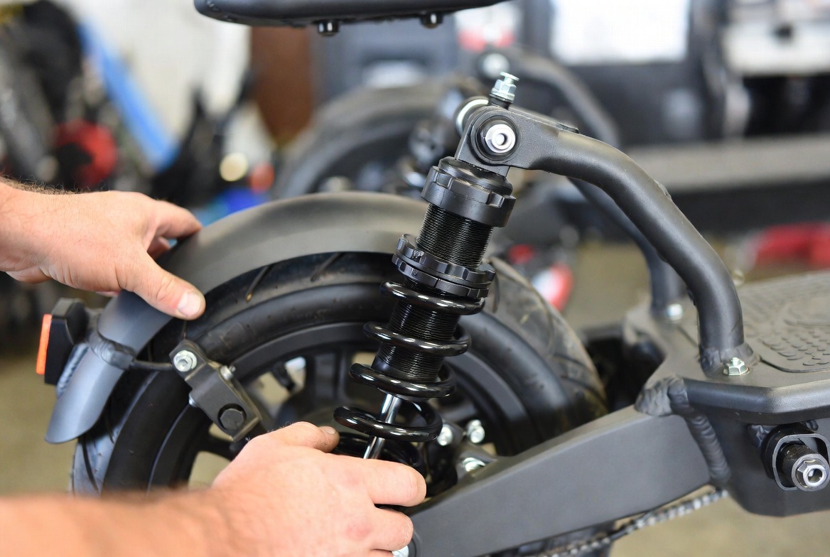 Coil-over suspension repair on an electric scooter